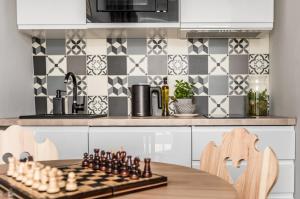 Kuchyňa alebo kuchynka v ubytovaní Apartamenty Smrekowa Turnia