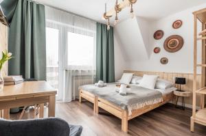 Posteľ alebo postele v izbe v ubytovaní Apartamenty Smrekowa Turnia