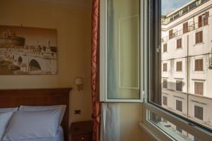 Postel nebo postele na pokoji v ubytování Hotel RomAntica
