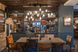 a dining room with a table and chairs at The Bridge Hotel in Chertsey