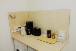 a kitchen counter with appliances on top of it at Guesthouse - Kuin Kotonaan in Kotka