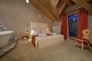 Postel nebo postele na pokoji v ubytování Hotel Cristallo
