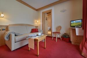 TV a/nebo společenská místnost v ubytování Hotel Cristallo