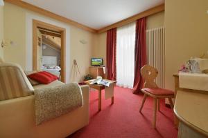 Postel nebo postele na pokoji v ubytování Hotel Cristallo
