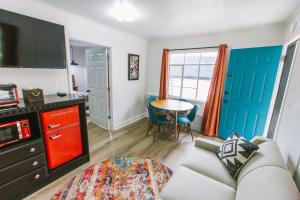 a living room with a couch and a table at Route 19 Inn in Maggie Valley
