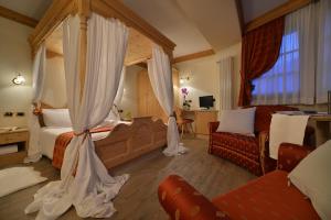 Postel nebo postele na pokoji v ubytování Hotel Cristallo