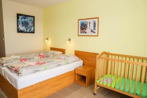 Postel nebo postele na pokoji v ubytování Hotel Zátoka