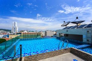 a swimming pool on the roof of a building at 77 Bangla Hotel - SHA Certified in Patong Beach