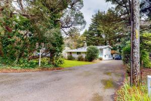 an empty street in a house with trees at Abalone Rose in Newport