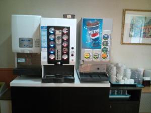 a coffee machine sitting on top of a counter at City Inn Nishi Tanabe / Vacation STAY 78536 in Osaka