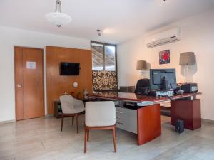 TV a/nebo společenská místnost v ubytování José y Glendy Hotel
