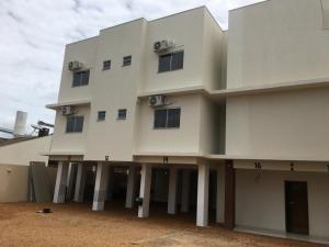 a large white building with columns and windows at Executive Hotel in Lucas do Rio Verde