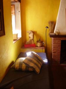 a stuffed animal sitting in a corner of a room at Casa El Menúo in Parauta