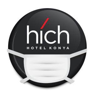 um sinal para um hotel coreano com um capacete em Hich Hotel Konya em Konya