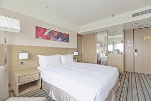 Voodi või voodid majutusasutuse Santos Hotel toas