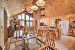 a kitchen with wooden walls and wooden ceiling at Family-Friendly Troy Getaway with Furnished Deck! in Unity