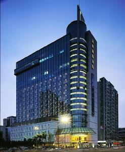 a large building with a lot of windows at Rainbird Hotel in Chengdu