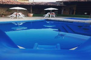 Bazén v ubytování Hotel Recanto Do Sol nebo v jeho okolí