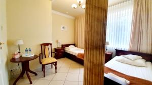 Posteľ alebo postele v izbe v ubytovaní BTHouse, Pokoje Gościnne