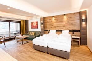 Rúm í herbergi á Hotel Tiefenbrunner