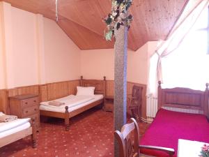 Ένα ή περισσότερα κρεβάτια σε δωμάτιο στο garni Hotel ASAS***