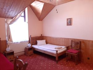 Ένα ή περισσότερα κρεβάτια σε δωμάτιο στο garni Hotel ASAS***