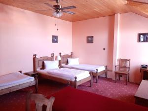 Ένα ή περισσότερα κρεβάτια σε δωμάτιο στο garni Hotel ASAS***