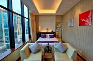 Voodi või voodid majutusasutuse The Bauhinia Hotel - Tsim Sha Tsui toas