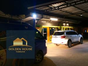 a white van parked in a garage at night at Golden House Hotel Sakaeo in Sa Kaeo