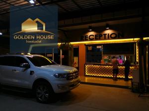a white truck parked in front of a restaurant at Golden House Hotel Sakaeo in Sa Kaeo