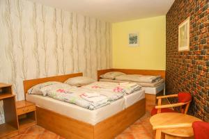 Postel nebo postele na pokoji v ubytování Hotel Zátoka