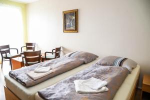 Postel nebo postele na pokoji v ubytování Hotel Zátoka