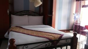 Postel nebo postele na pokoji v ubytování Egret Pilgrims Inn