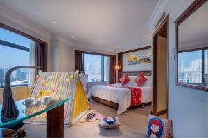 Postel nebo postele na pokoji v ubytování Changsha Sun Shine Hotel