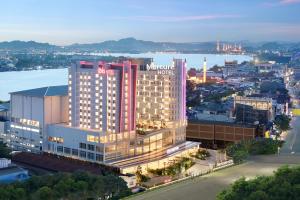 a rendering of a marriott hotel in a city at Mercure Samarinda in Samarinda
