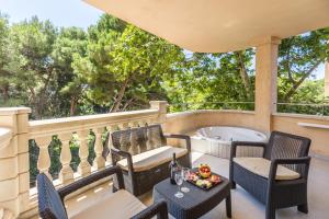 A balcony or terrace at Lago Garden Apart-Suites & Spa Hotel