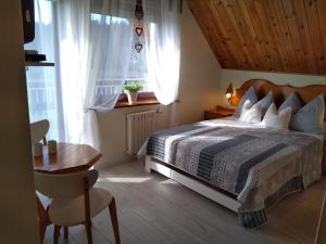 Postel nebo postele na pokoji v ubytování Jarek
