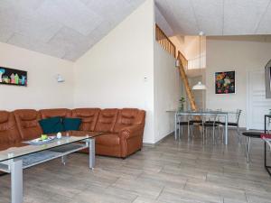 een woonkamer met een bank en een tafel bij 6 person holiday home in Hejls in Hejls