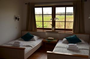 Rúm í herbergi á Hotel Na Statku Mirošov