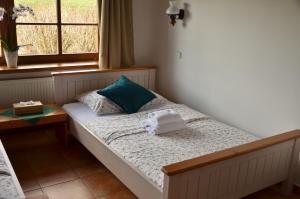 Rúm í herbergi á Hotel Na Statku Mirošov