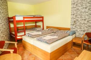 Postel nebo postele na pokoji v ubytování Hotel Zátoka