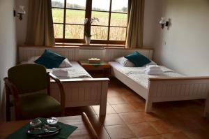 Rúm í herbergi á Hotel Na Statku Mirošov