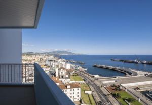 a view of the ocean from a balcony at Volcanic Ocean View (Ponta Delgada historic center) in Ponta Delgada