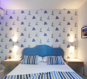 Postel nebo postele na pokoji v ubytování YourHome - Maison Nonna Anna
