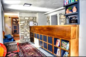 a living room with a book shelf and a couch at Ephesus Hostel in Selçuk