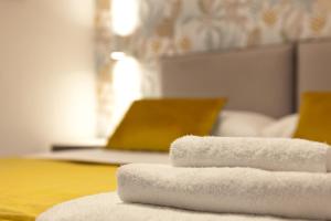 Postel nebo postele na pokoji v ubytování YourHome - Maison Nonna Anna