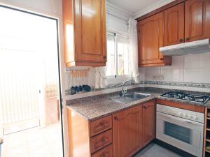 A kitchen or kitchenette at Holiday Home Tamarit Beach by Interhome