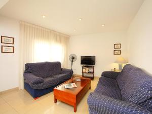 a living room with two couches and a tv at Apartment Giner by Interhome in Benidorm