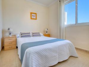 A bed or beds in a room at Apartment Bahia Blanca-1 by Interhome
