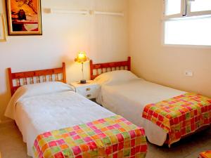 Postel nebo postele na pokoji v ubytování Apartment Celio I by Interhome